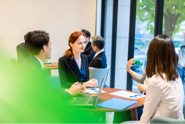 female-chatting-with-colleague-image.png