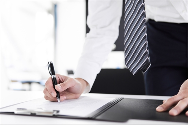 male-signing-document-image.png
